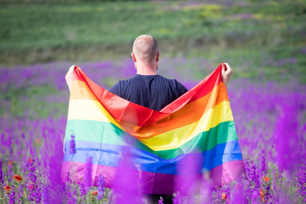 Young man with LGBT flag.