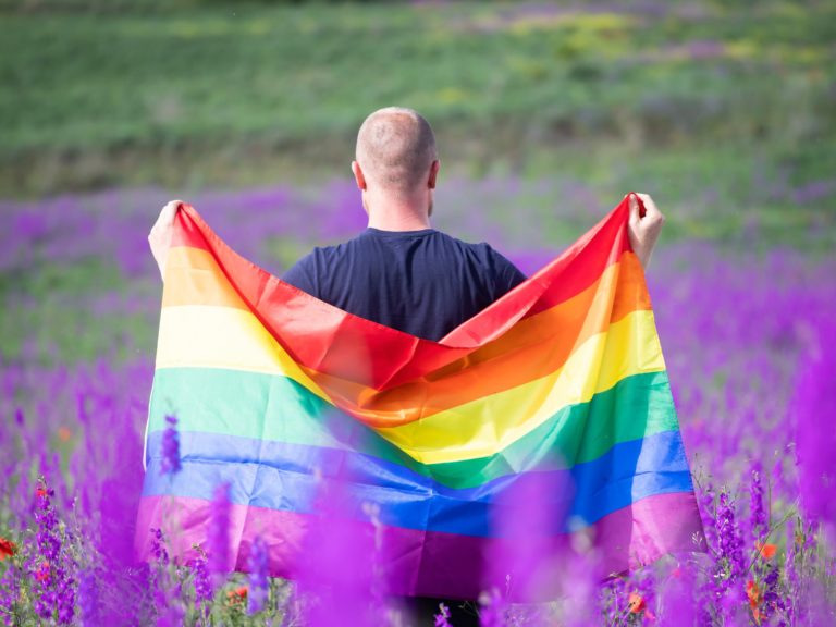 Young man with LGBT flag.